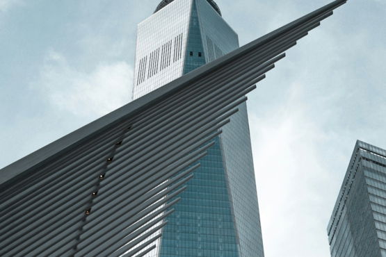 a very tall building with a sky background